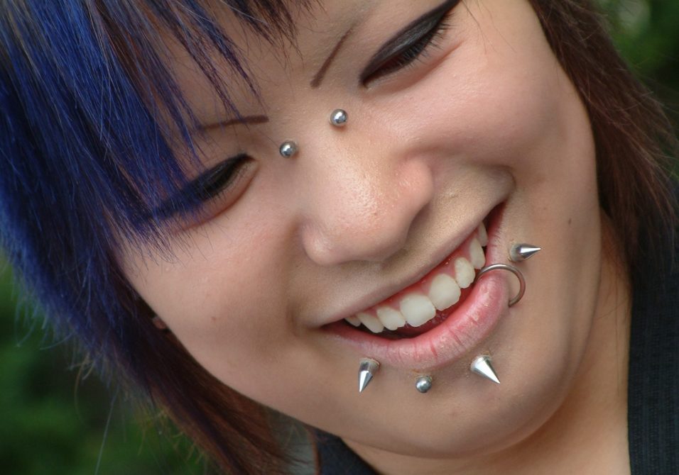 a lady with pierces to her face